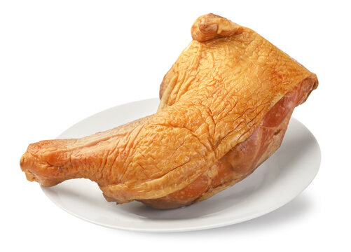 Smoked chicken leg on a plate on a white. Isolated