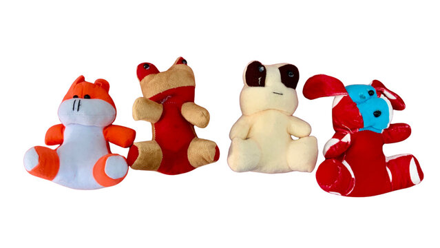 Four colorful handmade plush doll toys isolated on transparent background
