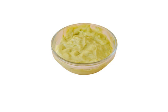 Fresh guacamole dip in clear glass bowl with transparent background