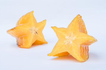 Fototapeta premium Fresh Ripe Starfruit Slices Isolated on White Background