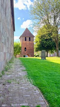 Lateral view of church in the village of bockhorn and garden 