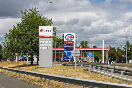 France 27 July 2026. Entrance sign for APRR Aire des Cheres Est highway rest area and Esso gas station with current fuel prices along A6 motorway.