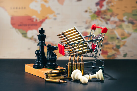 Rifle bullets and chess pieces on world map for geopolitics concept. a conceptual metaphor for global geopolitical conflict military war strategy defense economics and power planning