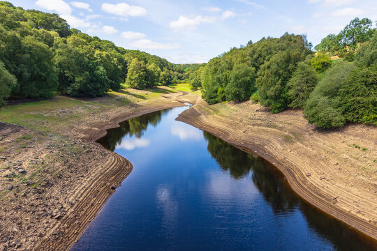 Leighton Reservoir near Masham in North Yorkshire showing exceptionally low water levels during the prolonged hot and dry summer of 2026.  The receding water has exposed wide areas of the reservoir