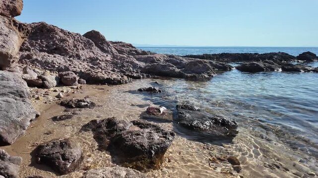Rocky coastline and crystal clear waters on the Aegean Sea on the island of Thasos, Greece