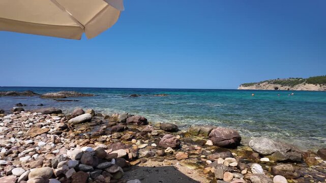 Rocky coastline and crystal clear waters on the Aegean Sea on the island of Thasos, Greece