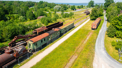 Obraz premium Aerial photo from a drone of the old trains and railways at the train station found in the town of Haapsalu in Estonia, Europa