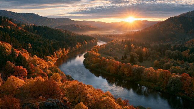 Aerial autumn river valley at golden sunrise with vibrant orange foliage