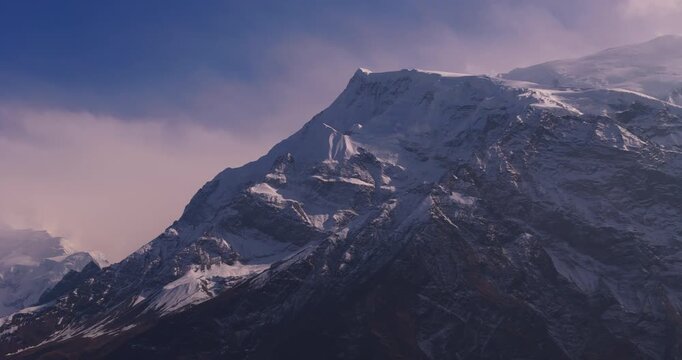 Annapurna Circuit, Manang, Nepal, panoramic aerial shot sweeping across snow-capped Himalayan mountain peaks in the Annapurna range