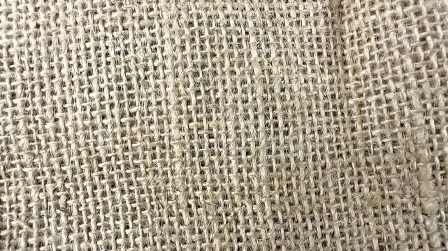 Top down view of natural woven burlap fabric texture