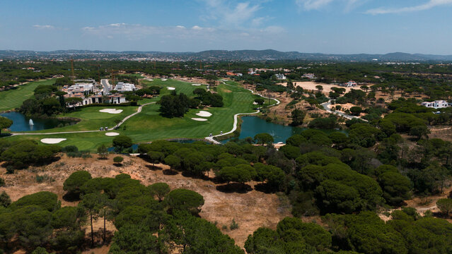 Golfers on the golf course, aerial view.