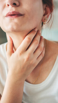 Young woman suffering from sore throat