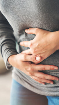 Young woman with stomach ache