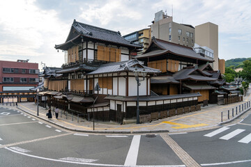 Naklejka premium Exterior of the historic Dogo Onsen Honkan wooden bathhouse in Matsuyama, Ehime Prefecture, Japan.