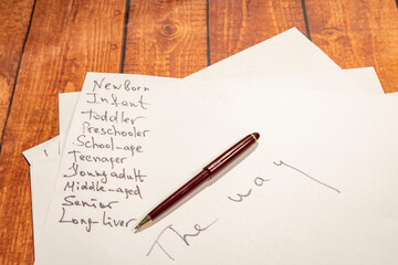 Naklejka premium White paper with inscriptions about age and life path