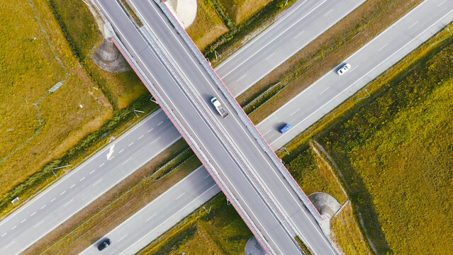 Vehicles crossing freeway overpass bridge