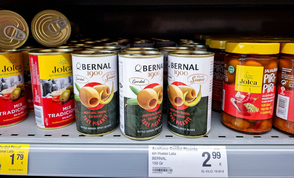 Denia, Spain - October 16, 2025.Canned Bernal Toke Picante pitted Gordal olives and Jolca olives on supermarket shelf in Spain