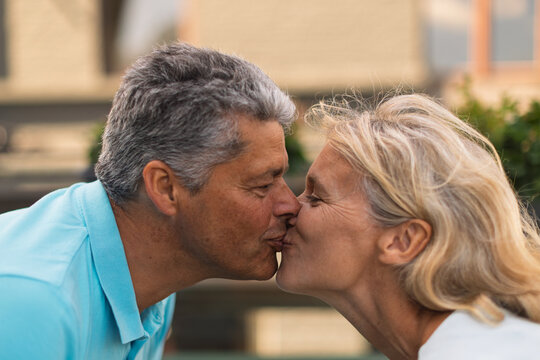Close-up of an affectionate kiss between a mature couple