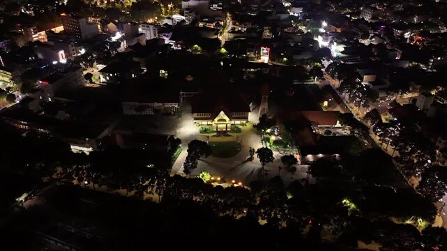 Cinematic Night Drone Hyperlapse of Buon Ma Thuot Bishop's Palace, Circular Aerial Movement Around Catholic Religious Architecture and Illuminated Diocese Landmark in Dak Lak, Vietnam