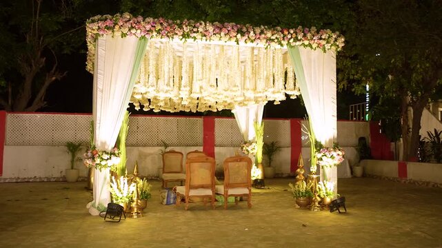 Elegant wedding mandap stage setup with floral decorations for Indian marriage ceremony
