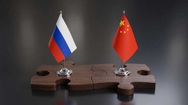 Miniature Flags of Russia and China on Puzzle Pieces Symbolizing Diplomatic Friendship