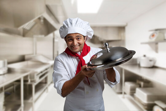 Portrait of a chef with a tray 