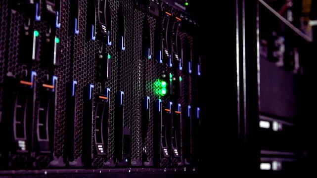 Industrial data server rack hardware with blinking green status lights computer hardware data center network technology information technology server cabinets