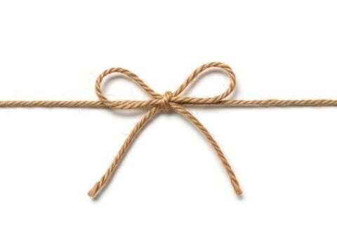 Simple rustic jute twine bow tied on a string isolated on white background