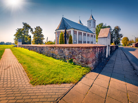 Majestic summer view of Catholic John the Baptist Church. Spectacular afternoon scene of Vainutas town, Silute District, Lithuania, Europe. Traveling concept background.