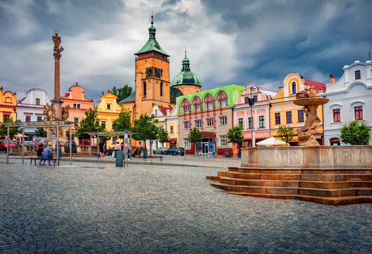 Rainy morning view of Church of the Assumption of the Virgin Mary, Marian Plague Column and Koudel's Fountain. Dramatic summer cityscape of Havlickuv Brod town, Vysocina Region, Czech Republic. 