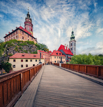 Wonderful morning view of St. Jost Church and Cesky Krumlov Castle. Exciting summer cityscape of Cesky Krumlov town, South Bohemia region, Czech Republic, Europe. Traveling concept background.