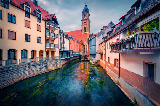 Marvelous summer cityscape of Amberg -  town in Bavaria, Germany, Europe. Superb morning view of bell tower of Basilika Sankt Martin and old colorful buildings on the shore of Vils river. 