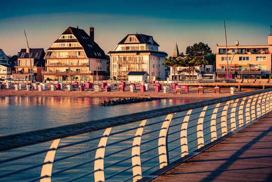 Marvelous morning view of popular tourist destination - Seebrucke Niendorf resort, Germany, Europe. Wonderful summer sunrise on Baltic sea. Vacation concept background.