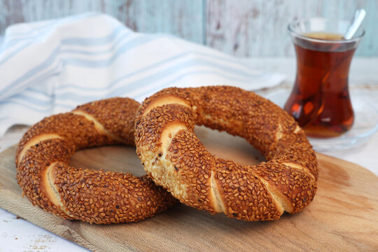 simit bagels on the and and glass of tea	