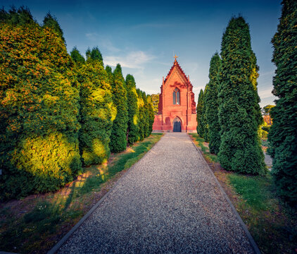 Empty walkway to Counts Tyshkevych Cahpel. Impressive summer cityscape of Kretinga town,  Lithuania, Europe. Traveling concept background.