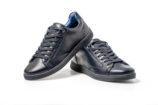 Black leather sneakers. Sport shoes isolated on white background, clipping path included