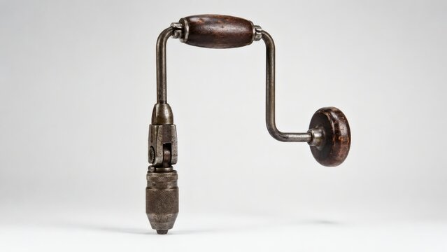 Vintage hand drill isolated on white background