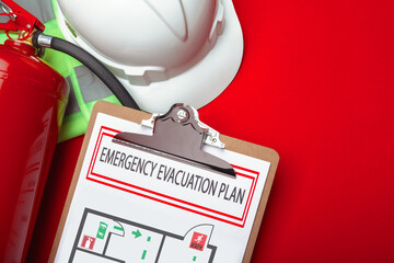 Emergency evacuation plan with safety equipment on a red background
