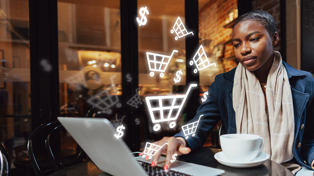 Online shopping at a cafe during the day with a woman using a laptop