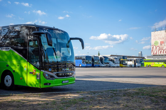 Warsaw, Masovian, Poland - July 02 2026: A prominent green FlixBus coach parked at Dworca Autobusowego Warszawa Zachodnia on a bright day.
