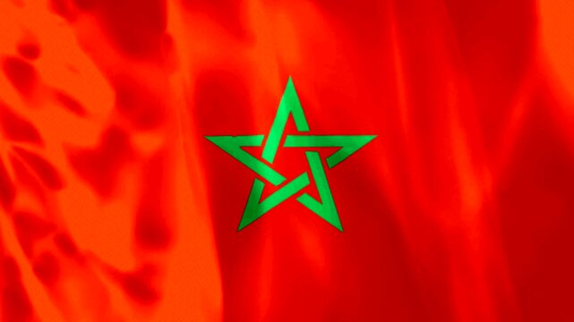 Waving flag of Morocco with a central green pentagram on a bright red background fabric texture