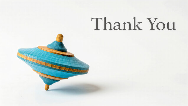 Blue and orange wooden spinning top, Thank You text with copy space