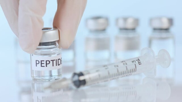 Peptide wellness therapy vial with syringe glove medical glass laboratory sterile injection for skincare research clinical health care
