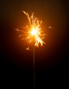 Light a Sparkler for fun in festival on black background