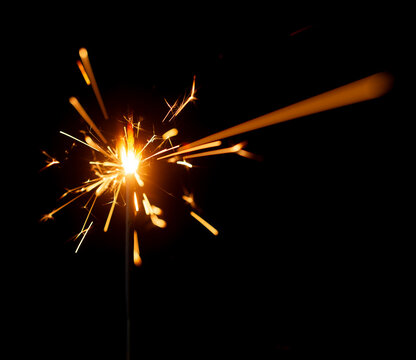 Light a Sparkler for fun in festival on black background