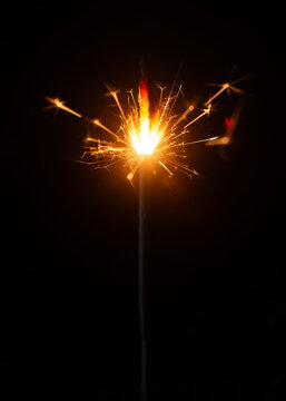 Light a Sparkler for fun in festival on black background