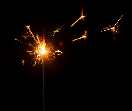 Light a Sparkler for fun in festival on black background