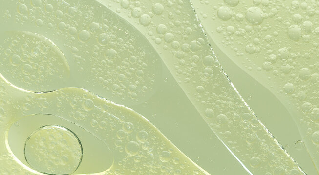 Abstract Green water bubbles essential oil beauty collagen Serum Repair cell background.