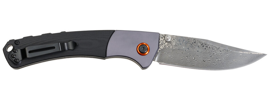 Folding knife with patterned Damascus steel blade and combination handle on isolated background.