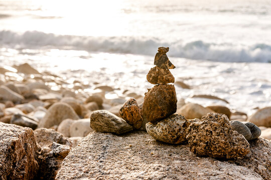 A stone cairn decorates the beach at Whitesand Bay in Cornwall